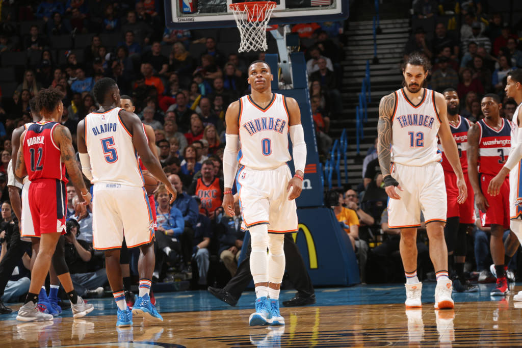 OKLAHOMA CITY, OK - NOVEMBER 30: Russell Westbrook #0 and Steven Adams #12 of the Oklahoma City Thunder are seen during the game against the Washington Wizards on November 30, 2016 at Chesapeake Energy Arena in Oklahoma City, Oklahoma. At 2:00 left in the 4th quarter, the Thunders Russell Westbrook recorded his 4th straight triple double (18 points, 12 rebounds, 10 assists). NOTE TO USER: User expressly acknowledges and agrees that, by downloading and or using this photograph, User is consenting to the terms and conditions of the Getty Images License Agreement. Mandatory Copyright Notice: Copyright 2016 NBAE Layne Murdoch/NBAE via Getty Images/AFP
