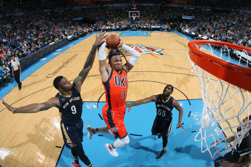 OKLAHOMA CITY, OK- DECEMBER 4: Russell Westbrook #0 of the Oklahoma City Thunder goes to the basket against the New Orleans Pelicans on December 4, 2016 at Chesapeake Energy Arena in Oklahoma City, Oklahoma. NOTE TO USER: User expressly acknowledges and agrees that, by downloading and or using this photograph, User is consenting to the terms and conditions of the Getty Images License Agreement. Mandatory Copyright Notice: Copyright 2016 NBAE   Layne Murdoch Sr./NBAE via Getty Images/AFP