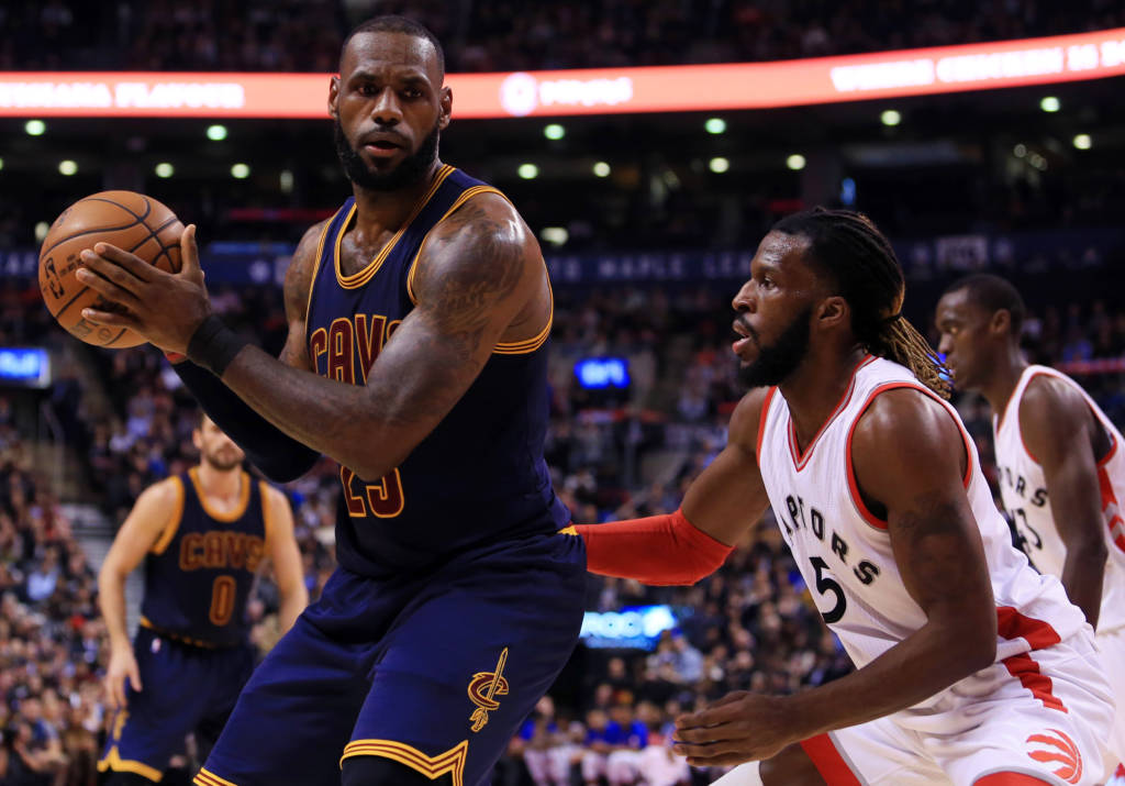 TORONTO, ON - DECEMBER 05: Lebron James #23 of the Cleveland Cavaliers dribbles the ball as DeMarre Carroll #5 of the Toronto Raptors defends during the first half of an NBA game at Air Canada Centre on December 5, 2016 in Toronto, Canada. NOTE TO USER: User expressly acknowledges and agrees that, by downloading and or using this photograph, User is consenting to the terms and conditions of the Getty Images License Agreement. Vaughn Ridley/Getty Images/AFP