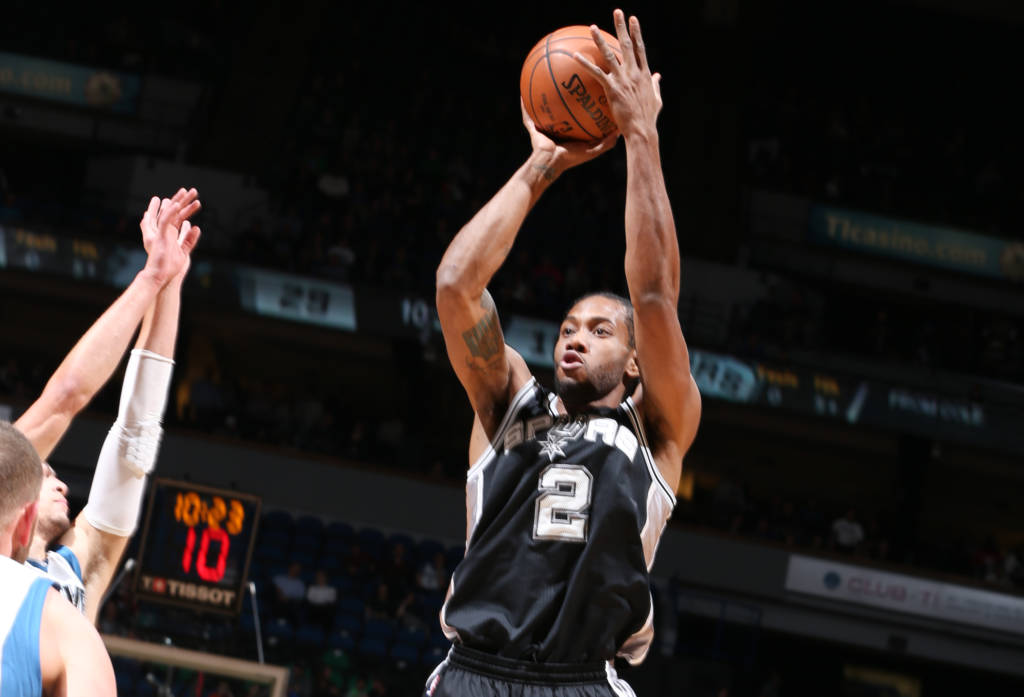 MINNEAPOLIS, MN - DECEMBER 6: Kawhi Leonard #2 of the San Antonio Spurs shoots the ball during a game against the Minnesota Timberwolves on December 6, 2016 at the Target Center in Minneapolis, Minnesota. NOTE TO USER: User expressly acknowledges and agrees that, by downloading and/or using this photograph, user is consenting to the terms and conditions of the Getty Images License Agreement. Mandatory Copyright Notice: Copyright 2016 NBAE David Sherman/NBAE via Getty Images/AFP