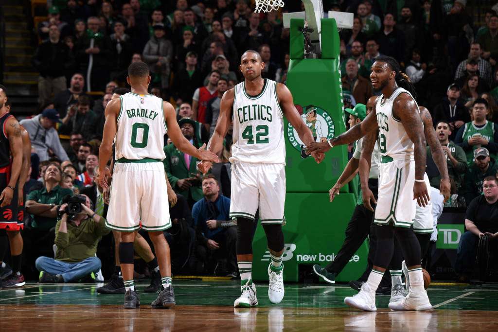 BOSTON, MA - DECEMBER 9: Al Horford #42 of the Boston Celtics high fives his teammates Avery Bradley #0 and Jae Crowder #99 of the Boston Celtics during the game against the Toronto Raptors on December 9, 2016 at TD Garden in Boston, Massachusetts. NOTE TO USER: User expressly acknowledges and agrees that, by downloading and or using this Photograph, user is consenting to the terms and conditions of the Getty Images License Agreement. Mandatory Copyright Notice: Copyright 2016 NBAE Brian Babineau/NBAE via Getty Images/AFP