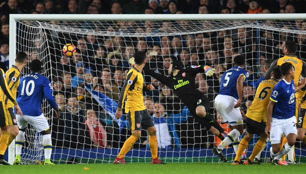 Everton's English-born Welsh defender Ashley Williams (3R) scores his team's second goal during the English Premier League football match between Everton and Arsenal at Goodison Park in Liverpool, north west England on December 13, 2016. / AFP PHOTO / Paul ELLIS / RESTRICTED TO EDITORIAL USE. No use with unauthorized audio, video, data, fixture lists, club/league logos or 'live' services. Online in-match use limited to 75 images, no video emulation. No use in betting, games or single club/league/player publications. /