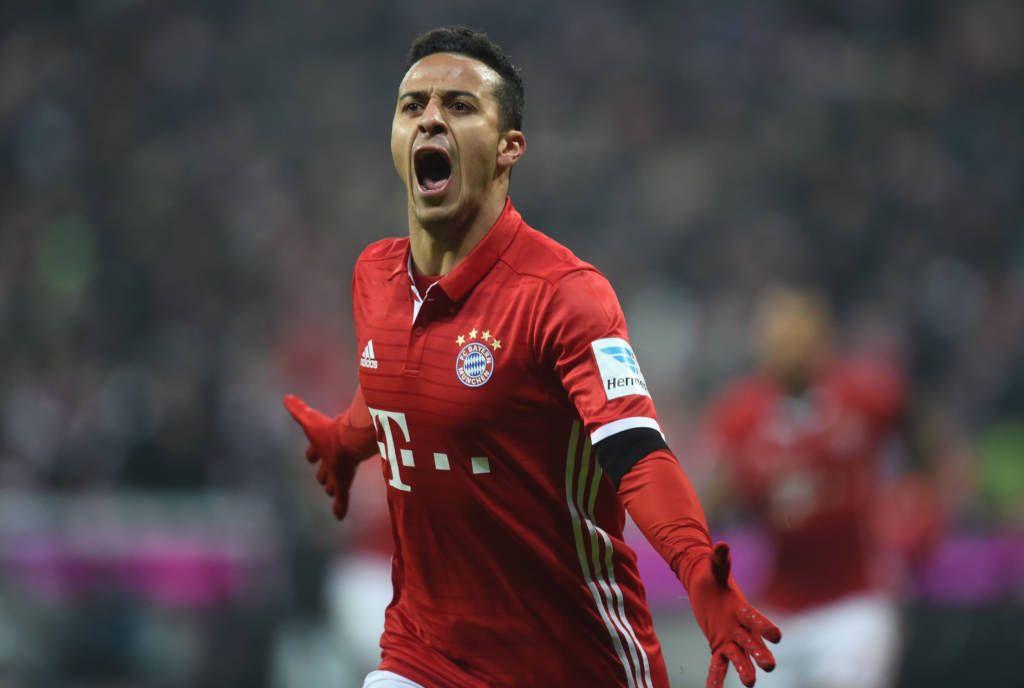 Bayern Munich's Spanish midfielder Thiago Alcantara celebrates after his first goal during the German first division Bundesliga football match FC Bayern Munich vs RB Leipzig in Munich, Germany, on December 21, 2016. / AFP PHOTO / Christof STACHE / RESTRICTIONS: DURING MATCH TIME: DFL RULES TO LIMIT THE ONLINE USAGE TO 15 PICTURES PER MATCH AND FORBID IMAGE SEQUENCES TO SIMULATE VIDEO. == RESTRICTED TO EDITORIAL USE == FOR FURTHER QUERIES PLEASE CONTACT DFL DIRECTLY AT + 49 69 650050