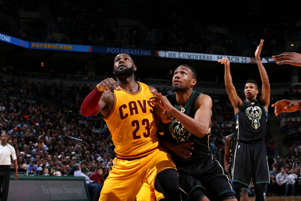 Milwaukee, WI - DECEMBER 20: LeBron James #23 of the Cleveland Cavaliers boxes out against Jabari Parker #12 of the Milwaukee Bucks during the game on December 20, 2016 at the BMO Harris Bradley Center in Milwaukee, Wisconsin. NOTE TO USER: User expressly acknowledges and agrees that, by downloading and or using this Photograph, user is consenting to the terms and conditions of the Getty Images License Agreement. Mandatory Copyright Notice: Copyright 2016 NBAE Gary Dineen/NBAE via Getty Images/AFP