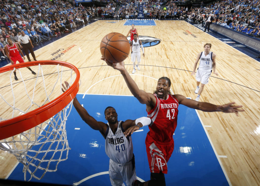 DALLAS, TX - DECEMBER 27: Nene Hilario #42 of the Houston Rockets goes in for the lay up against the Dallas Mavericks on December 27, 2016 at the American Airlines Center in Dallas, Texas. NOTE TO USER: User expressly acknowledges and agrees that, by downloading and or using this photograph, User is consenting to the terms and conditions of the Getty Images License Agreement. Mandatory Copyright Notice: Copyright 2016 NBAE   Glenn James/NBAE via Getty Images/AFP