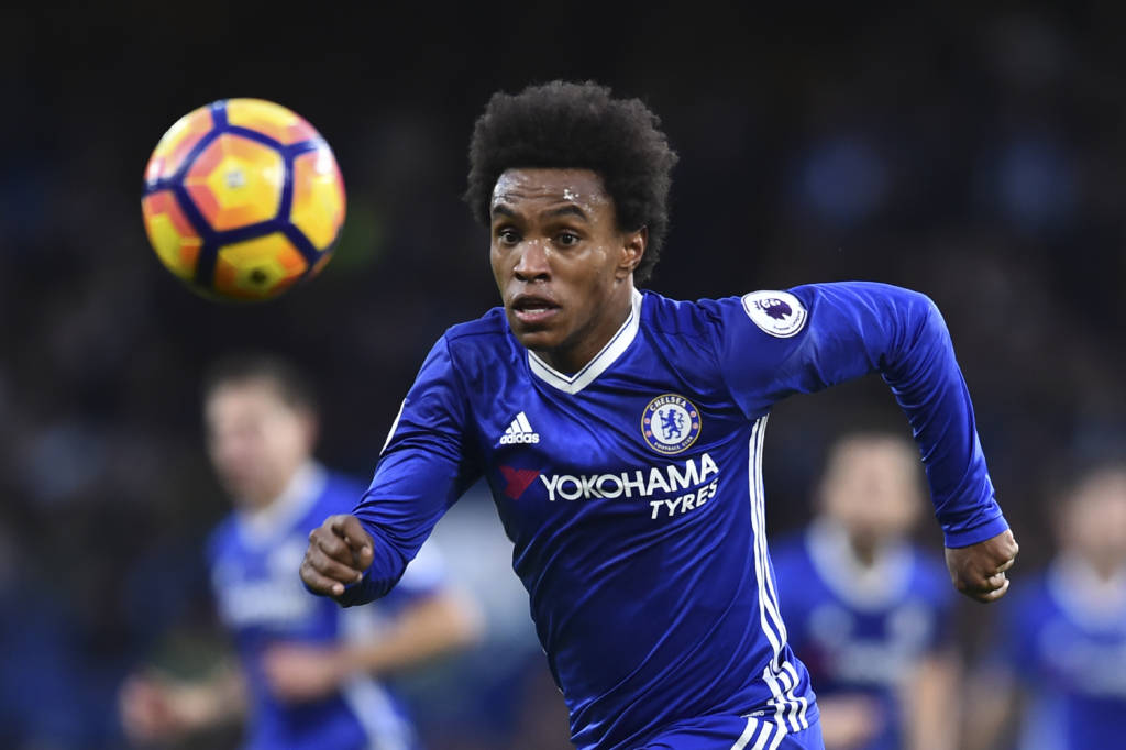 Chelsea's Brazilian midfielder Willian chases the ball during the English Premier League football match between Chelsea and Bournemouth at Stamford Bridge in London on December 26, 2016. / AFP PHOTO / Glyn KIRK / RESTRICTED TO EDITORIAL USE. No use with unauthorized audio, video, data, fixture lists, club/league logos or 'live' services. Online in-match use limited to 75 images, no video emulation. No use in betting, games or single club/league/player publications.  /