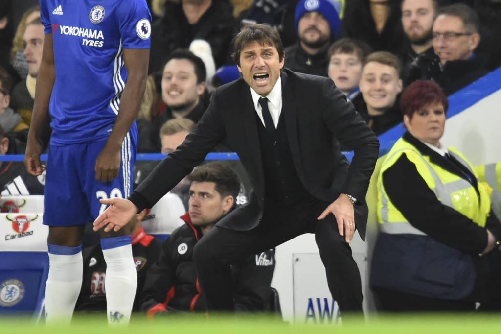 Chelsea's Italian head coach Antonio Conte gesture from the touchline during the English Premier League football match between Chelsea and Bournemouth at Stamford Bridge in London on December 26, 2016. / AFP PHOTO / Glyn KIRK / RESTRICTED TO EDITORIAL USE. No use with unauthorized audio, video, data, fixture lists, club/league logos or 'live' services. Online in-match use limited to 75 images, no video emulation. No use in betting, games or single club/league/player publications. /
