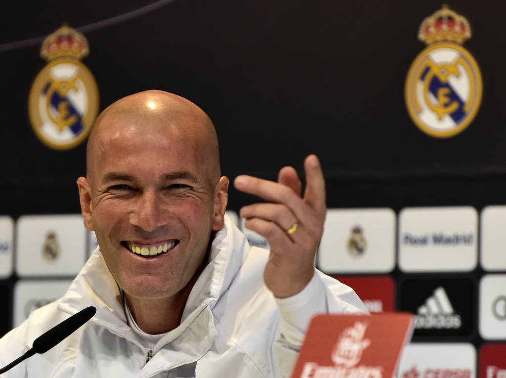 Real Madrid's French coach Zinedine Zidane smiles during a press conference at Valdebebas Sport City in Madrid on January 3, 2017, on the eve of the Spanish Copa del Rey (King's Cup) match Real Madrid CF vs Sevilla FC. / AFP PHOTO / GERARD JULIEN