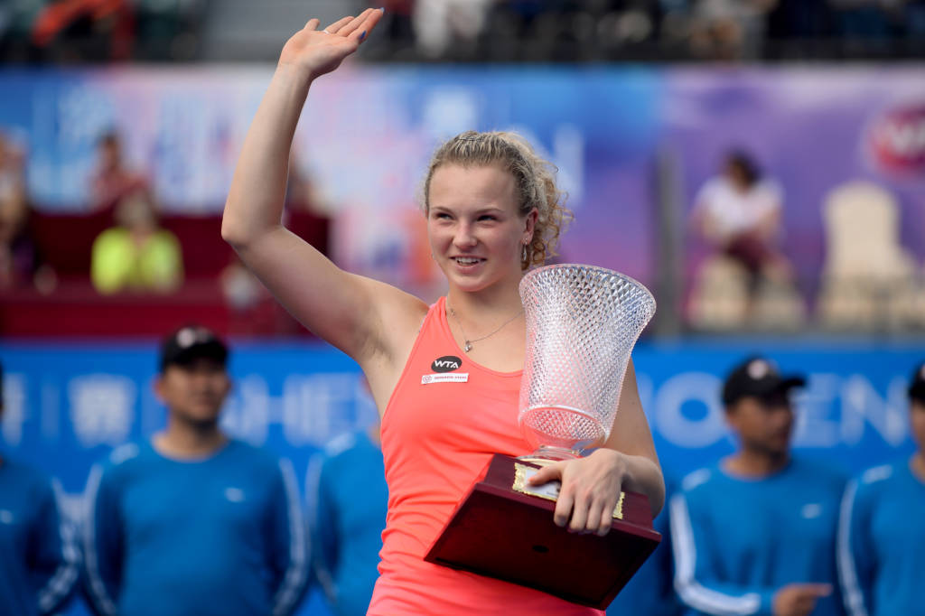 Katerina Siniakova of the Czech Republic waves to the audience after winning the women's singles final match against Alison Riske of the US at the WTA Shenzhen Open in Shenzhen in China's southern Guangdong province on January 7, 2017. / AFP PHOTO / STR / China OUT