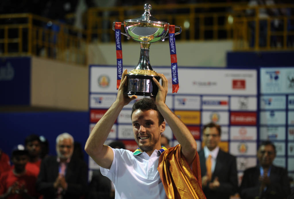 Roberto Buatista Agut of Spain holds the trophy after beating Daniil Medvedev of Russia in the final men's singles match at Chennai Open Tennis Championship in Chennai on January 8, 2017. / AFP PHOTO / ARUN SANKAR