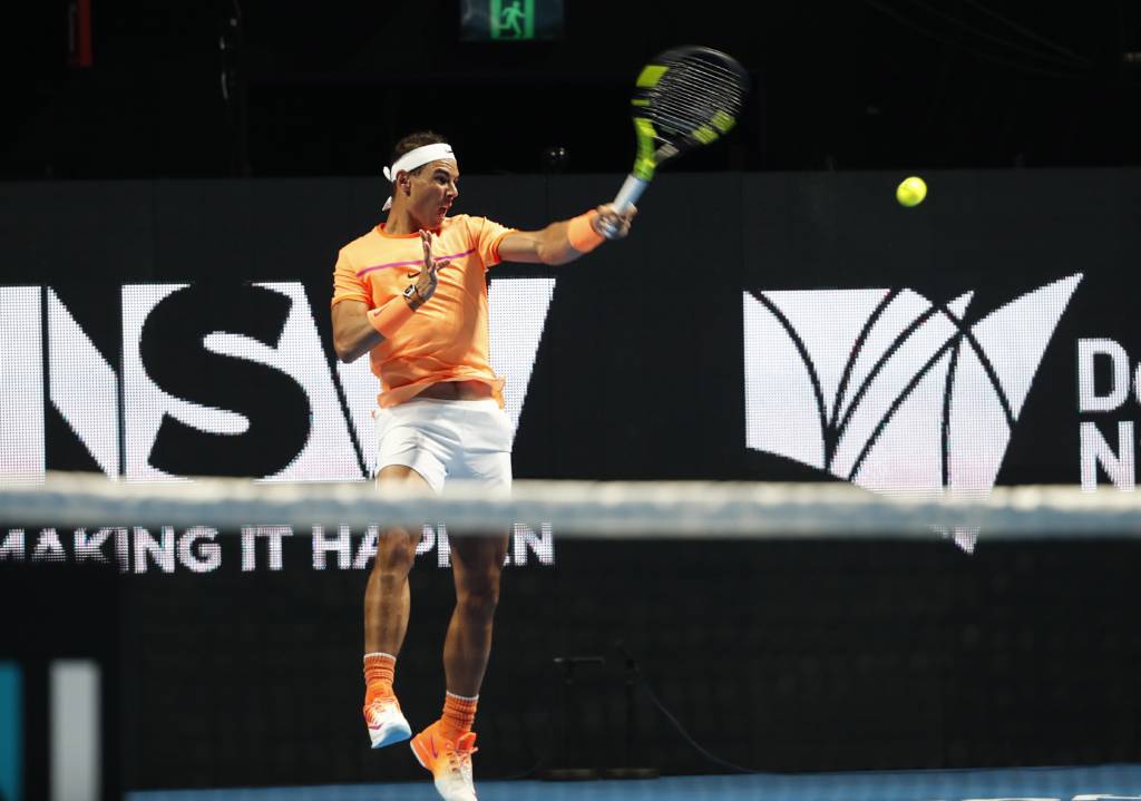 Rafael Nadal of Spain hits a return to Nick Kyrgios of Australia at an exhibition match of Fast4 Tennis during the Sydney International tennis tournament in Sydney on January 9, 2017. / AFP PHOTO / GLENN NICHOLLS / IMAGE RESTRICTED TO EDITORIAL USE - STRICTLY NO COMMERCIAL USE