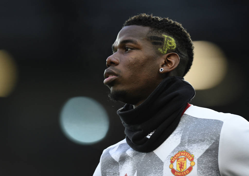 Manchester United's French midfielder Paul Pogba warms up ahead of the English Premier League football match between Manchester United and Liverpool at Old Trafford in Manchester, north west England, on January 15, 2017. / AFP PHOTO / Oli SCARFF / RESTRICTED TO EDITORIAL USE. No use with unauthorized audio, video, data, fixture lists, club/league logos or 'live' services. Online in-match use limited to 75 images, no video emulation. No use in betting, games or single club/league/player publications.  /