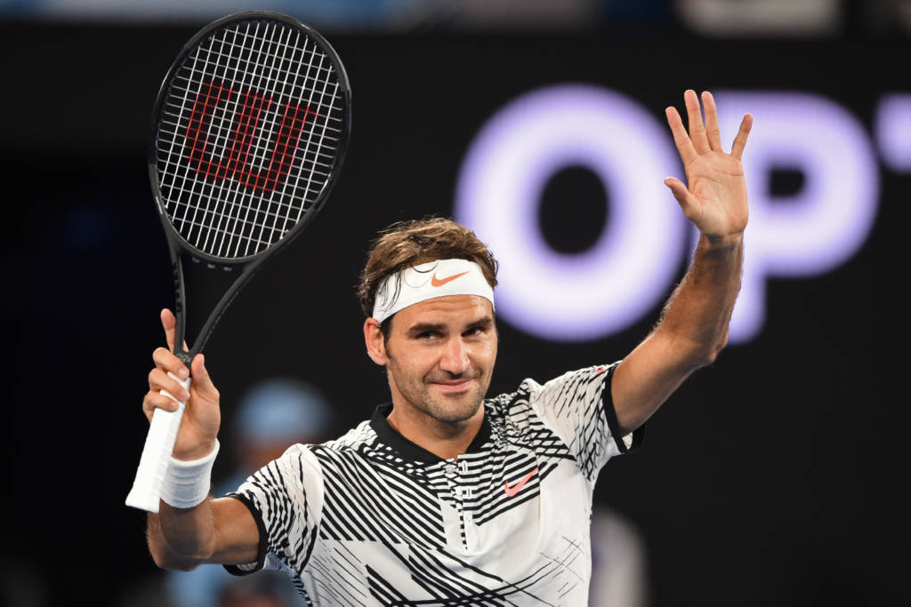 Switzerland's Roger Federer celebrates after victory against Austria's Jurgen Melzer during their men's singles match on day one of the Australian Open tennis tournament in Melbourne on January 16, 2017. / AFP PHOTO / PETER PARKS / IMAGE RESTRICTED TO EDITORIAL USE - STRICTLY NO COMMERCIAL USE