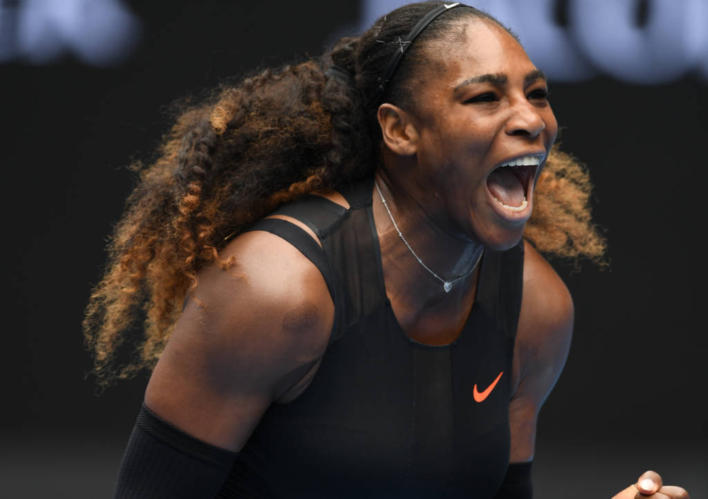 Serena Williams of the US reacts after a point against Switzerland's Belinda Bencic during their women's singles match on day two of the Australian Open tennis tournament in Melbourne on January 17, 2017. / AFP PHOTO / GREG WOOD / IMAGE RESTRICTED TO EDITORIAL USE - STRICTLY NO COMMERCIAL USE