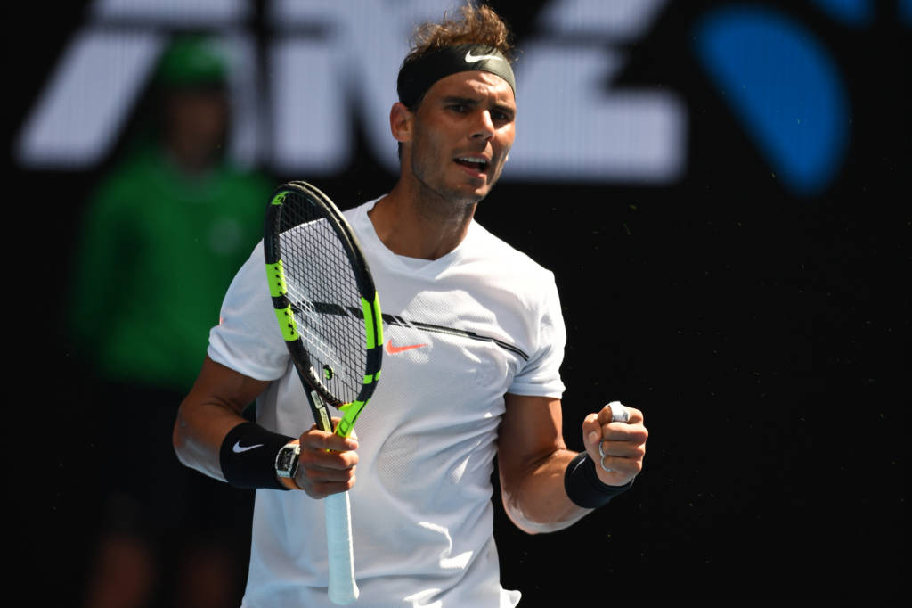 Spain's Rafael Nadal reacts after a point against Germany's Florian Mayer during their men's singles match on day two of the Australian Open tennis tournament in Melbourne on January 17, 2017. / AFP PHOTO / GREG WOOD / IMAGE RESTRICTED TO EDITORIAL USE - STRICTLY NO COMMERCIAL USE