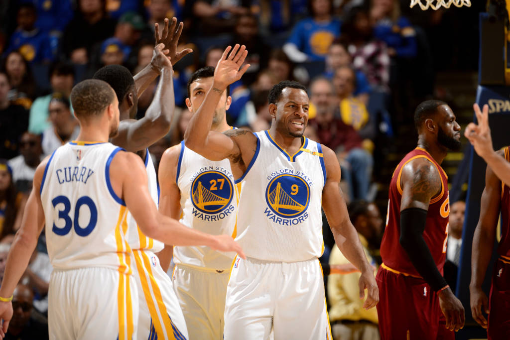 OAKLAND, CA - JANUARY 16: Andre Iguodala #9 of the Golden State Warriors high fives his teammates during the game against the Cleveland Cavaliers on January 16, 2017 at ORACLE Arena in Oakland, California. NOTE TO USER: User expressly acknowledges and agrees that, by downloading and or using this photograph, user is consenting to the terms and conditions of Getty Images License Agreement. Mandatory Copyright Notice: Copyright 2017 NBAE   Noah Graham/NBAE via Getty Images/AFP