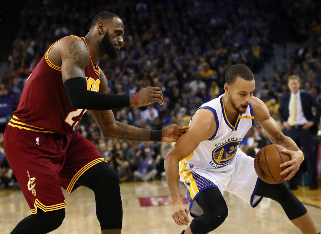 OAKLAND, CA - JANUARY 16: Stephen Curry #30 of the Golden State Warriors steals the ball from LeBron James #23 of the Cleveland Cavaliers at ORACLE Arena on January 16, 2017 in Oakland, California. NOTE TO USER: User expressly acknowledges and agrees that, by downloading and or using this photograph, User is consenting to the terms and conditions of the Getty Images License Agreement.   Ezra Shaw/Getty Images/AFP