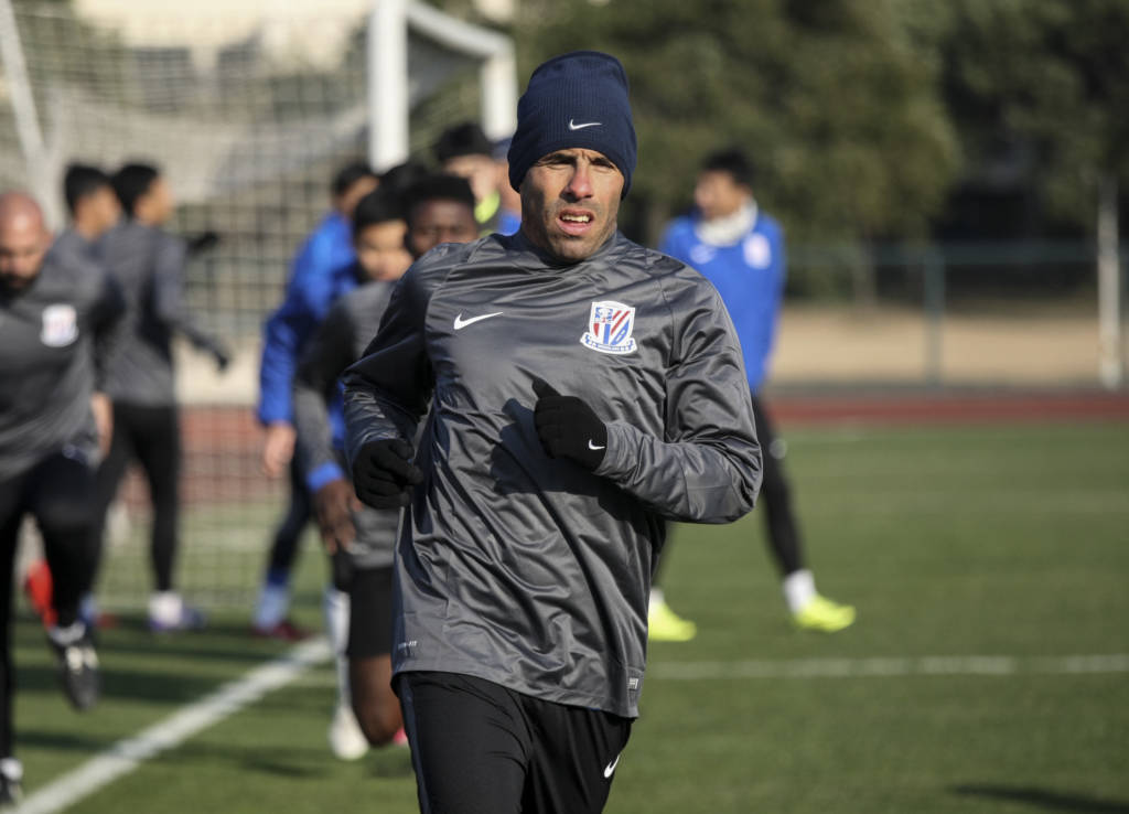 Argentine striker Carlos Tevez takes part in his first training session with his new club Shanghai Shenhua in Shanghai on January 21, 2017. / AFP PHOTO / STR / China OUT