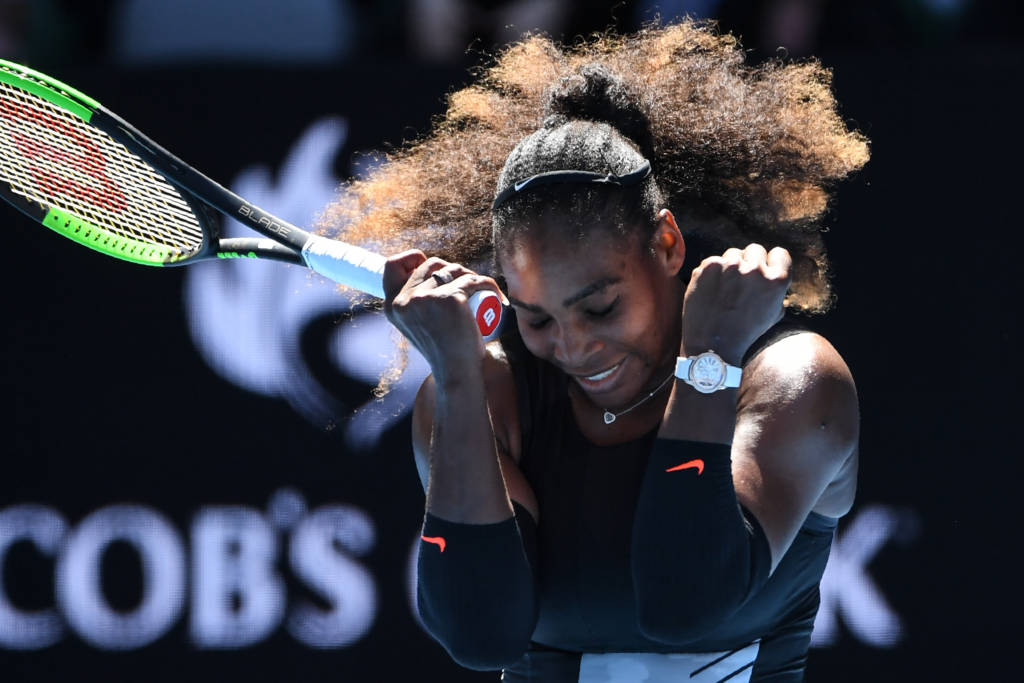 Serena Williams of the US celebrates her victory against Britain's Johanna Konta during their women's singles quarter-final match on day ten of the Australian Open tennis tournament in Melbourne on January 25, 2017. / AFP PHOTO / WILLIAM WEST / IMAGE RESTRICTED TO EDITORIAL USE - STRICTLY NO COMMERCIAL USE