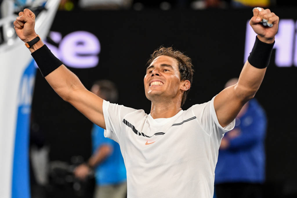 Spain's Rafael Nadal celebrates his victory against Canada's Milos Raonic during their men's singles quarter-final match on day ten of the Australian Open tennis tournament in Melbourne on January 25, 2017. / AFP PHOTO / SAEED KHAN / IMAGE RESTRICTED TO EDITORIAL USE - STRICTLY NO COMMERCIAL USE