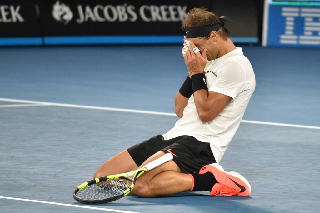 Spain's Rafael Nadal celebrates beating Canada's Milos Raonic in their men's singles quarter-final match on day ten of the Australian Open tennis tournament in Melbourne on January 25, 2017. / AFP PHOTO / PETER PARKS / IMAGE RESTRICTED TO EDITORIAL USE - STRICTLY NO COMMERCIAL USE