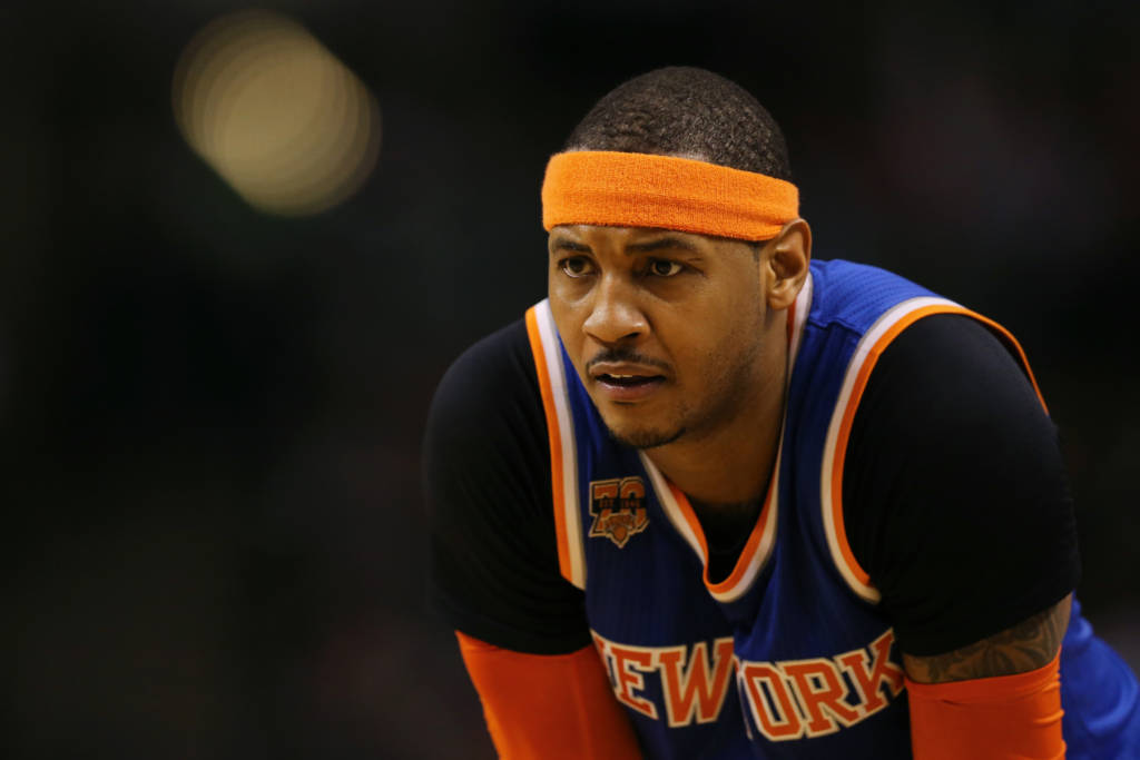 BOSTON, MA - JANUARY 18: Carmelo Anthony #7 of the New York Knicks looks on during the second half against the Boston Celtics at TD Garden on January 18, 2017 in Boston, Massachusetts. The Knicks defeat the Celtics 117-106. NOTE TO USER: User expressly acknowledges and agrees that, by downloading and or using this Photograph, user is consenting to the terms and conditions of the Getty Images License Agreement. Maddie Meyer/Getty Images/AFP