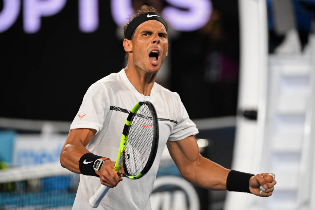 Spain's Rafael Nadal reacts after a point against Bulgaria's Grigor Dimitrov during their men's singles semi-final match on day 12 of the Australian Open tennis tournament in Melbourne on January 27, 2017. / AFP PHOTO / SAEED KHAN / IMAGE RESTRICTED TO EDITORIAL USE - STRICTLY NO COMMERCIAL USE