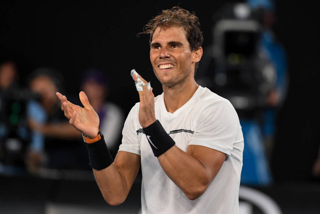 Spain's Rafael Nadal celebrates his victory against against Bulgaria's Grigor Dimitrov during their men's singles semi-final match on day 12 of the Australian Open tennis tournament in Melbourne on January 28, 2017. / AFP PHOTO / SAEED KHAN / IMAGE RESTRICTED TO EDITORIAL USE - STRICTLY NO COMMERCIAL USE