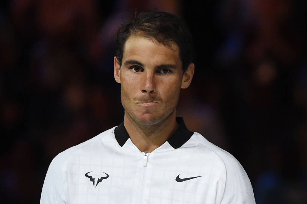 Runner-up Spain's Rafael Nadal reacts during the awards ceremony after the men's singles final match against Switzerland's Roger Federer on day 14 of the Australian Open tennis tournament in Melbourne on January 29, 2017. / AFP PHOTO / PAUL CROCK / IMAGE RESTRICTED TO EDITORIAL USE - STRICTLY NO COMMERCIAL USE