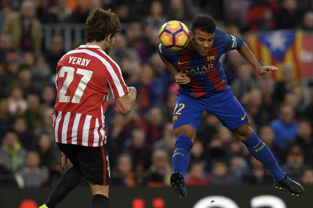 Barcelona's Brazilian midfielder Rafinha (R) vies with Athletic Bilbao's defender Yeray Alvarez during the Spanish league football match FC Barcelona vs Athletic Club Bilbao at the Camp Nou stadium in Barcelona on February 4, 2017. / AFP PHOTO / LLUIS GENE