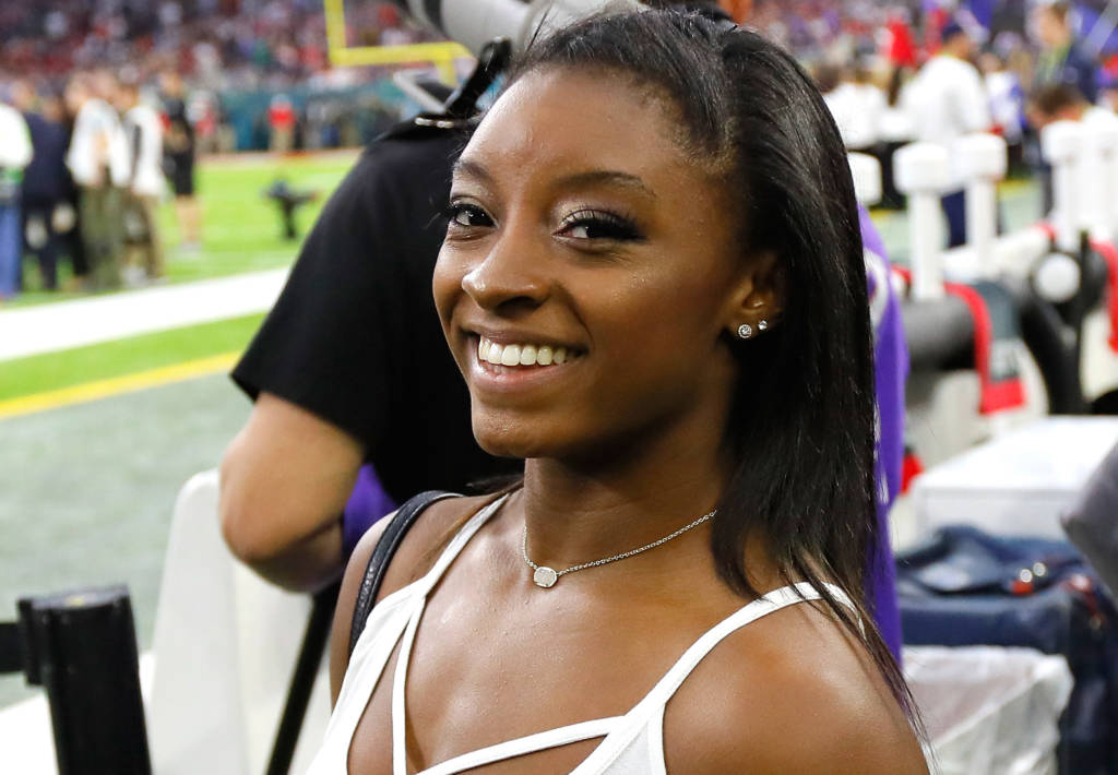 HOUSTON, TX - FEBRUARY 05: Gymnast Simone Biles looks on during Super Bowl 51 between the Atlanta Falcons and the New England Patriots at NRG Stadium on February 5, 2017 in Houston, Texas.   Kevin C. Cox/Getty Images/AFP