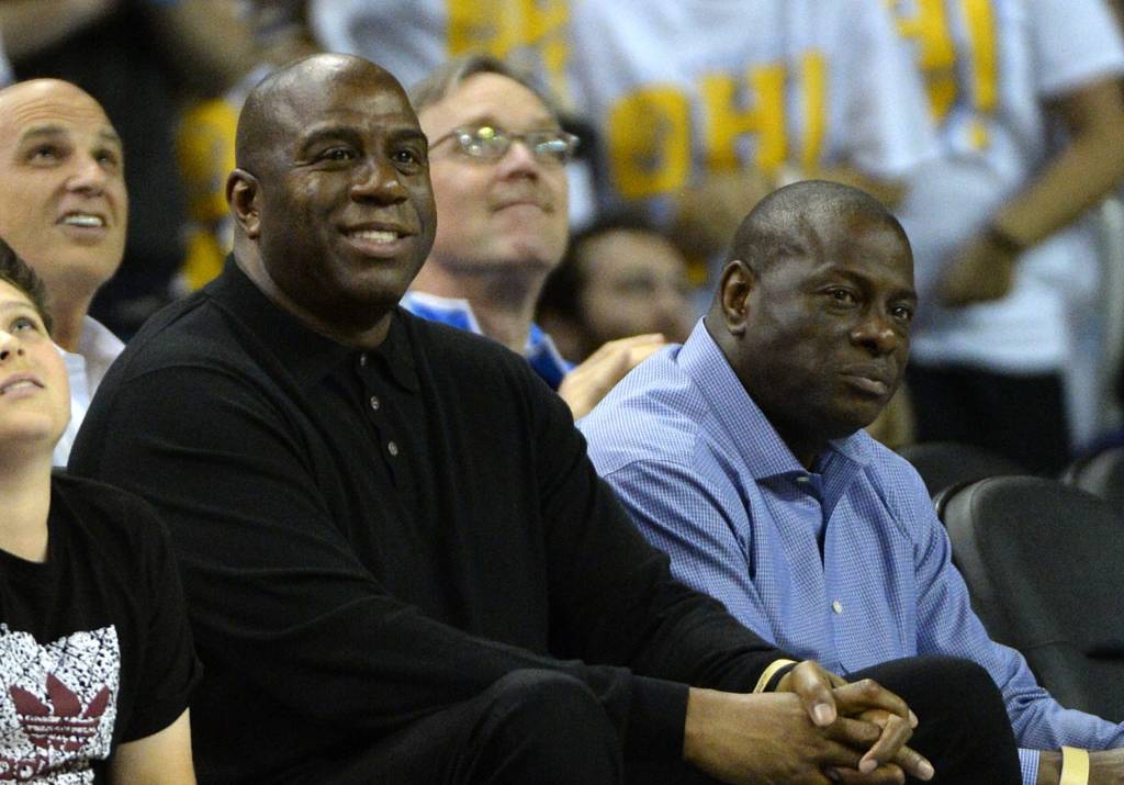 (FILES) This file photo taken on February 8, 2017 shows NBA legend Earvin "Magic" Johnson during the game between the UCLA Bruins and the Oregon Ducks at Pauley Pavilion in Los Angeles, California.   Los Angeles Lakers legend Magic Johnson on February 14, 2017 said he is keen to find a role for Kobe Bryant as he attempts to help revive the flagging NBA franchise's fortunes. The Lakers confirmed earlier this month that Johnson had been hired as an adviser to co-owner and president Jeanie Buss with a wide-ranging brief touching on "all business and basketball matters".Johnson, 57, said that his first move -- if he was given power to do so -- would be to try and recruit the recently retired Bryant into the set-up.  / AFP PHOTO / GETTY IMAGES NORTH AMERICA / ROBERT LABERGE