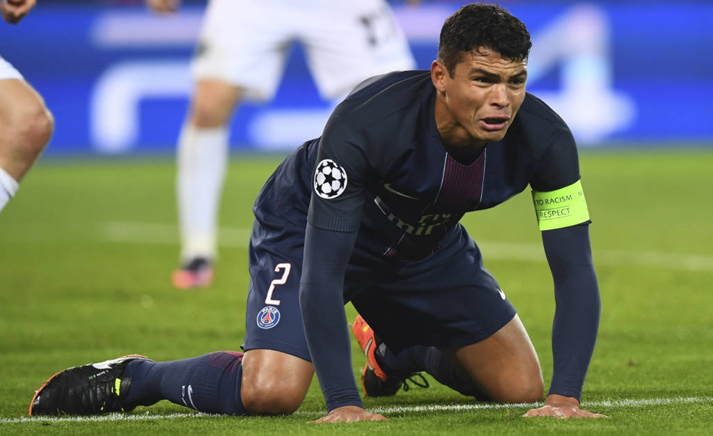 (FILES) This file photo taken on December 06, 2016 shows Paris Saint-Germain's Brazilian defender Thiago Silva looking on during the UEFA Champions League Group A football match between Paris Saint-Germain and PCF Ludogorets Razgrad at the Parc des Princes Stadium in Paris. Paris Saint-Germain's Brazilian defender Thiago Silva is ruled out for the Valentine's Day Champions League last 16 first leg date with Barcelona at the Parc des Princes on February 14, 2017. / AFP PHOTO / FRANCK FIFE