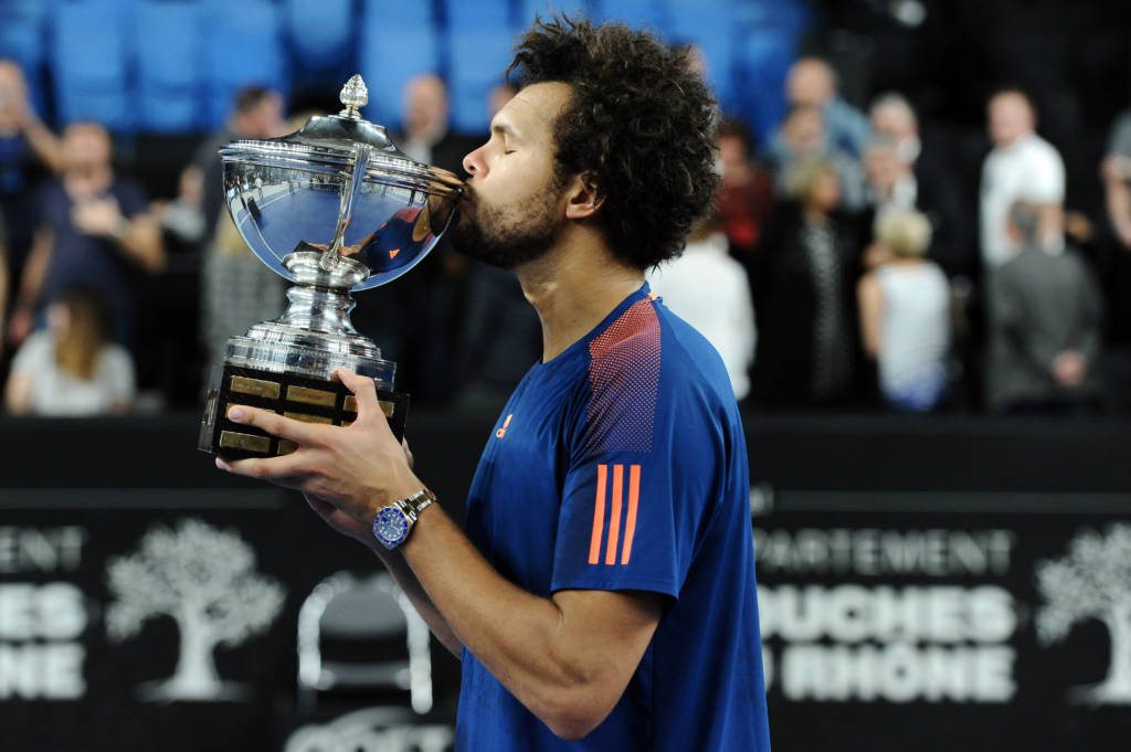 France's Jo-Wilfried Tsonga celebrates with his trophy after winning his ATP Marseille Open 13 tennis final match against France's Lucas Pouille on February 26, 2017 in Marseille, southern France.  Tsonga won 6-4, 6-4. / AFP PHOTO / Franck PENNANT
