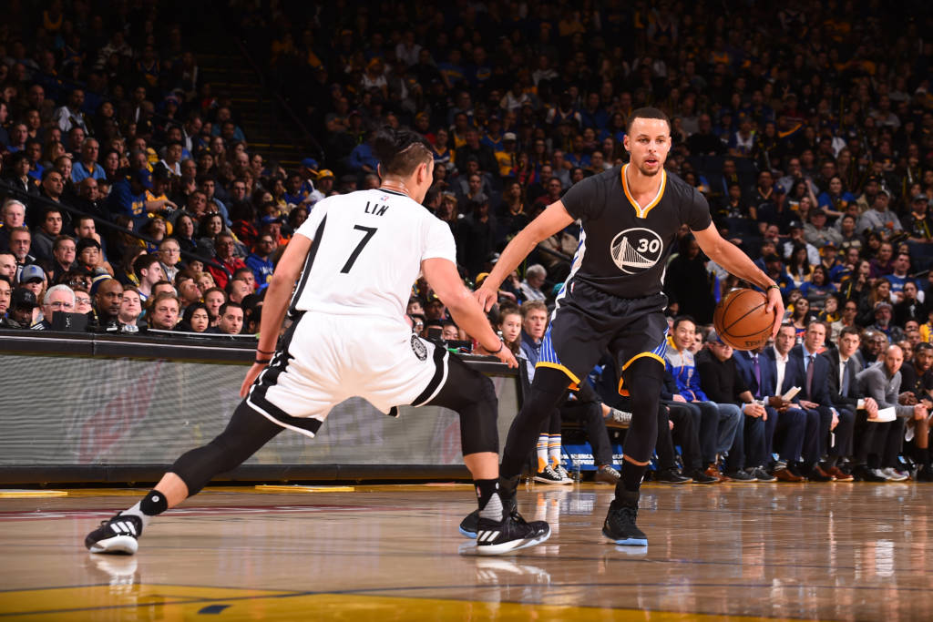 OAKLAND, CA - FEBRUARY 25: Stephen Curry #30 of the Golden State Warriors handles the ball against the Brooklyn Nets on February 25, 2017 at ORACLE Arena in Oakland, California. NOTE TO USER: User expressly acknowledges and agrees that, by downloading and or using this photograph, user is consenting to the terms and conditions of Getty Images License Agreement. Mandatory Copyright Notice: Copyright 2017 NBAE   Noah Graham/NBAE via Getty Images/AFP
