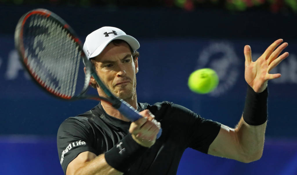 World number one Andy Murray of Great Britain returns the ball to France's Lucas Pouille during their ATP semi-final tennis match as part of the Dubai Duty Free Championships on March 3, 2017. / AFP PHOTO / KARIM SAHIB