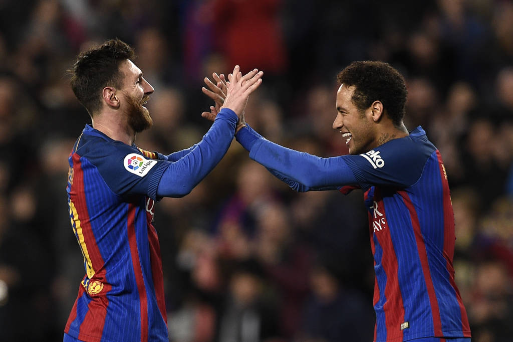 Barcelona's Argentinian forward Lionel Messi (L) celebrates with Barcelona's Brazilian forward Neymar (R) after scoring a goal during the Spanish league football match FC Barcelona vs RC Celta de Vigo at the Camp Nou stadium in Barcelona on March 4, 2017. / AFP PHOTO / LLUIS GENE