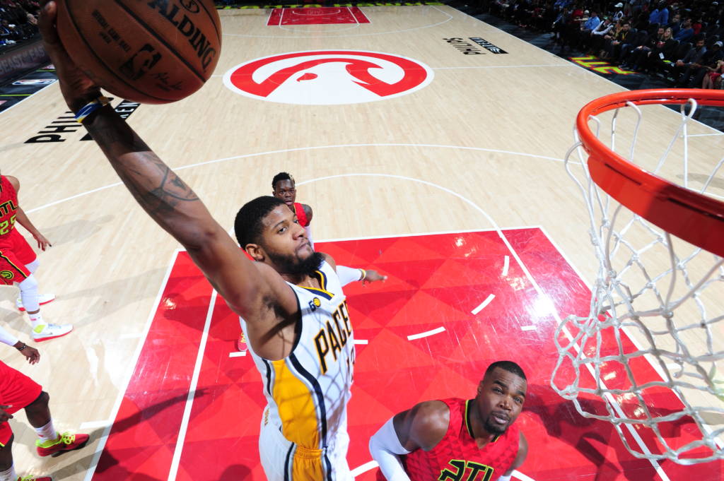 ATLANTA, GA - MARCH 5: Paul George #13 of the Indiana Pacers dunks against the Atlanta Hawks on March 5, 2017 at Philips Arena in Atlanta, Georgia. NOTE TO USER: User expressly acknowledges and agrees that, by downloading and/or using this Photograph, user is consenting to the terms and conditions of the Getty Images License Agreement. Mandatory Copyright Notice: Copyright 2017 NBAE Scott Cunningham/NBAE via Getty Images/AFP