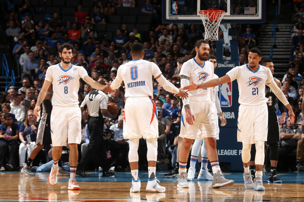 OKLAHOMA CITY, OK- MARCH 9: Russell Westbrook #0, Alex Abrines #8 and Andre Roberson #21 of the Oklahoma City Thunder high five each other during the game against the San Antonio Spurs on March 9, 2017 at Chesapeake Energy Arena in Oklahoma City, Oklahoma. NOTE TO USER: User expressly acknowledges and agrees that, by downloading and or using this photograph, User is consenting to the terms and conditions of the Getty Images License Agreement. Mandatory Copyright Notice: Copyright 2017 NBAE Layne Murdoch/NBAE via Getty Images/AFP