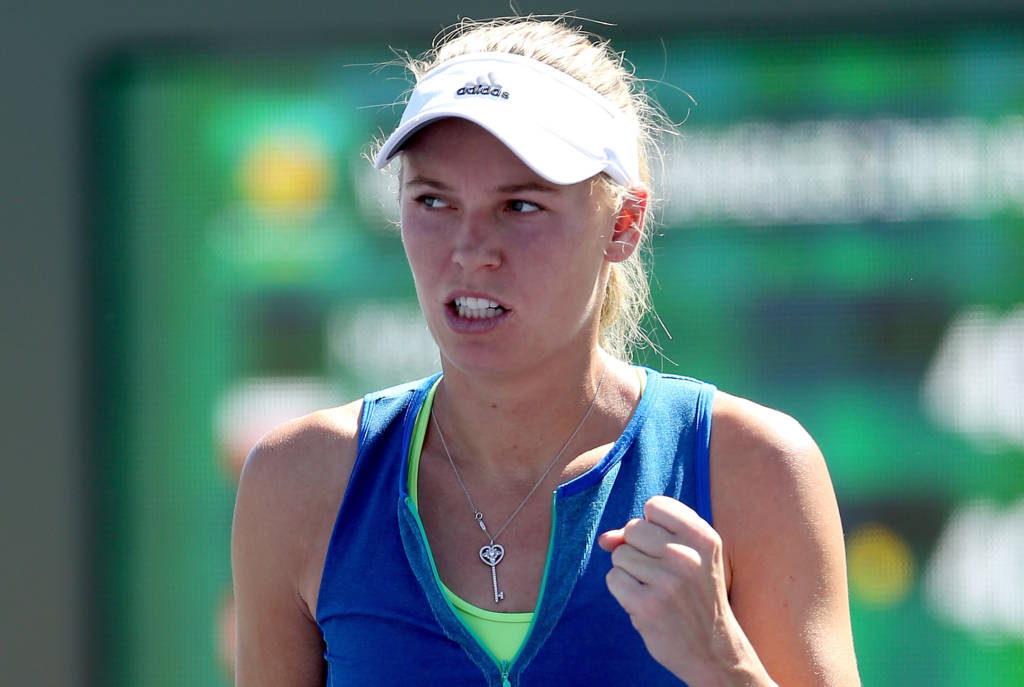 INDIAN WELLS, CA - MARCH 11: Caroline Wozniacki of Denmark celebrate a point against Magda Linette of Poland during the BNP Paribas Open at the Indian Wells Tennis Garden on March 11, 2017 in Indian Wells, California.   Matthew Stockman/Getty Images/AFP