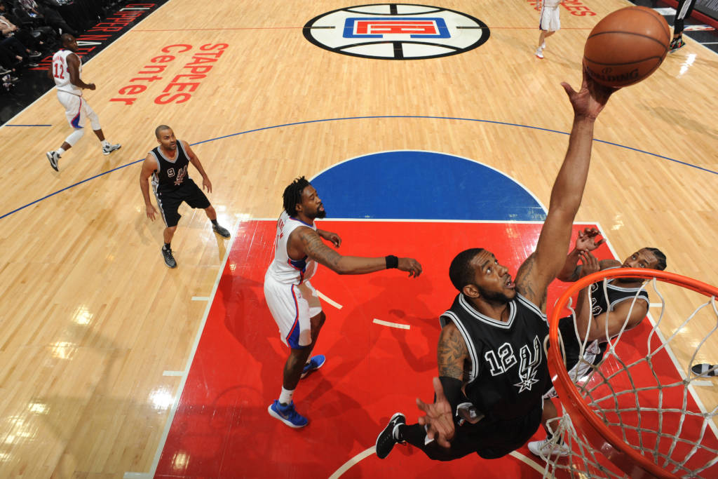 LOS ANGELES, CA - FEBRUARY 24: LaMarcus Aldridge #12 of the San Antonio Spurs grabs the rebound against the LA Clippers on February 24, 2017 at STAPLES Center in Los Angeles, California. NOTE TO USER: User expressly acknowledges and agrees that, by downloading and/or using this Photograph, user is consenting to the terms and conditions of the Getty Images License Agreement. Mandatory Copyright Notice: Copyright 2017 NBAE Andrew D. Bernstein/NBAE via Getty Images/AFP