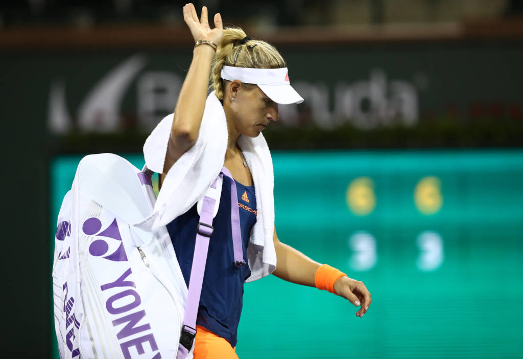 INDIAN WELLS, CA - MARCH 14: Angelique Kerber of Germany walks off the court after her straight set defeat by Elena Vesnina of Russia in their fourth round match during day nine of the BNP Paribas Open at Indian Wells Tennis Garden on March 14, 2017 in Indian Wells, California.   Clive Brunskill/Getty Images/AFP