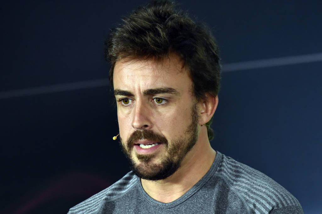 McLaren's Spanish driver Fernando Alonso speaks during a press conference in Melbourne on March 23, 2017, ahead of the Formula One Australian Grand Prix. / AFP PHOTO / SAEED KHAN / -- IMAGE RESTRICTED TO EDITORIAL USE - STRICTLY NO COMMERCIAL USE --